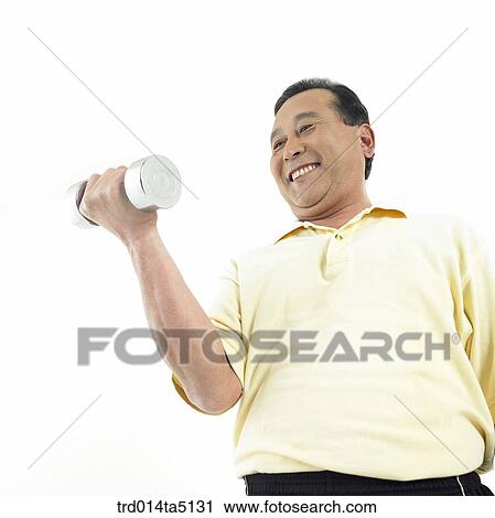 Stock Image - The old/ a man doing exercise with dumbbells. Fotosearch