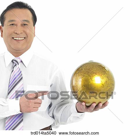 The old/ A man pointing at a globe View Large Photo Image Stock Image - The old/ A man pointing at a globe. Fotosearch