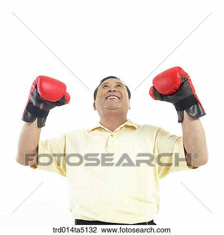 The old/ a man wearing boxing gloves View Large Photo Image Stock Image - The old/ a man wearing boxing gloves. Fotosearch