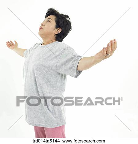 The old/ a woman outstretching her arms View Large Photo Image Picture - The old/ a woman outstretching her arms. Fotosearch
