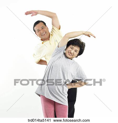 Stock Image - The old/ an old couple warming up. Fotosearch