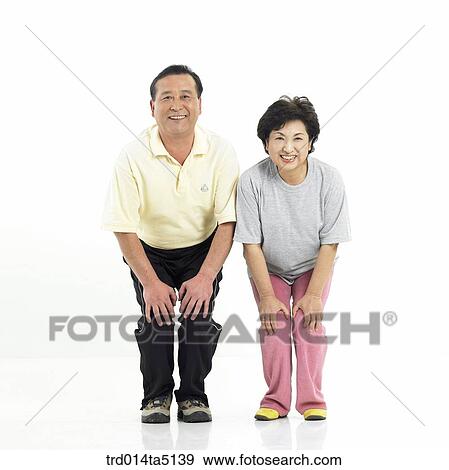 The old/ an old couple warming up View Large Photo Image Stock Photo - The old/ an old couple warming up. Fotosearch