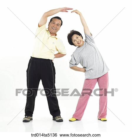 Stock Photograph - The old/ an old couple warming up. Fotosearch