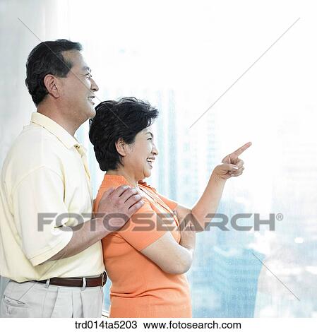 Stock Image - a smiling old couple. Fotosearch