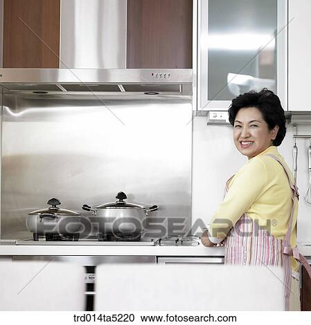 an cooking old woman at a kitchen View Large Photo Image Stock Image - an cooking old woman at a kitchen. Fotosearch