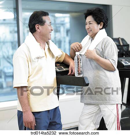 an exercising old couple at a fitness club View Large Photo Image Stock Image - an exercising old couple at a fitness club. Fotosearch