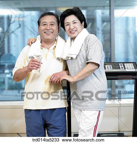 an exercising old couple at a fitness club View Large Photo Image Stock Image - an exercising old couple at a fitness club. Fotosearch