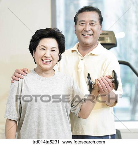 an exercising old couple with dumbbells at a fitness club View Large Photo Image Stock Image - an exercising old couple with dumbbells at a fitness club. Fotosearch