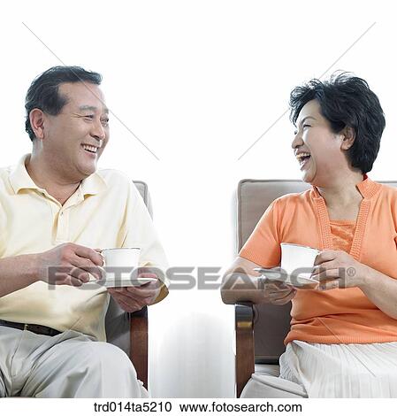 an old couple drinking tea on a chair View Large Photo Image Stock Image - an old couple drinking tea on a chair. Fotosearch