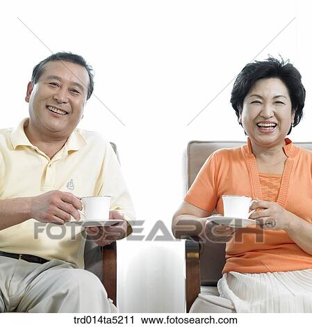 an old couple drinking tea on a chair View Large Photo Image Stock Image - an old couple drinking tea on a chair. Fotosearch