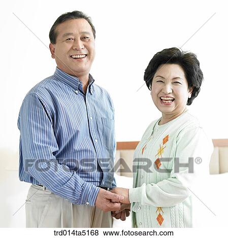 an old couple holding each other's hands View Large Photo Image Stock Photo - an old couple holding each other's hands. Fotosearch