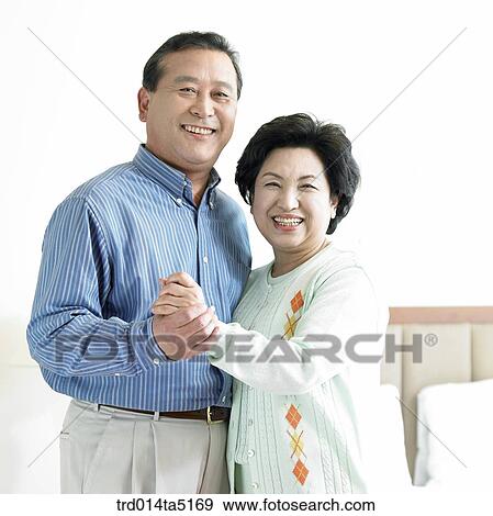 an old couple holding each other's hands View Large Photo Image Stock Photo - an old couple holding each other's hands. Fotosearch