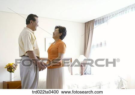 an old couple looking at each other on a bed View Large Photo Image Stock Image - an old couple looking at each other on a bed. Fotosearch