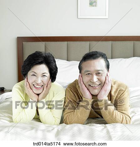 an old couple on a bed View Large Photo Image Picture - an old couple on a bed. Fotosearch