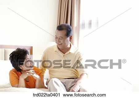 an old couple on a bed View Large Photo Image Stock Image - an old couple on a bed. Fotosearch