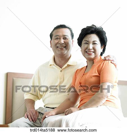 an old couple on a bed View Large Photo Image Stock Photo - an old couple on a bed. Fotosearch