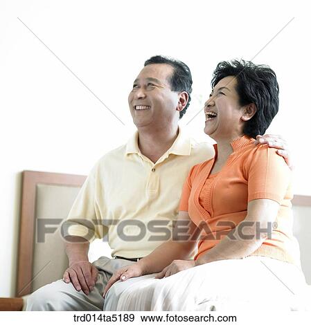 an old couple on a bed View Large Photo Image Stock Photo - an old couple on a bed. Fotosearch