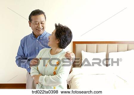 an old couple on a bed View Large Photo Image Stock Photo - an old couple on a bed. Fotosearch