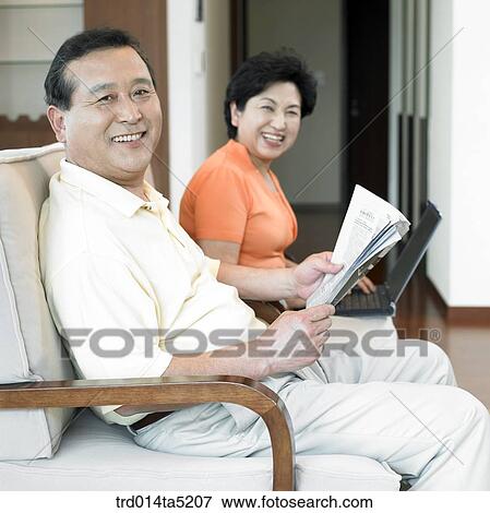 Stock Photo - an old couple on a chair. Fotosearch