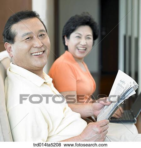 Stock Photo - an old couple on a chair. Fotosearch