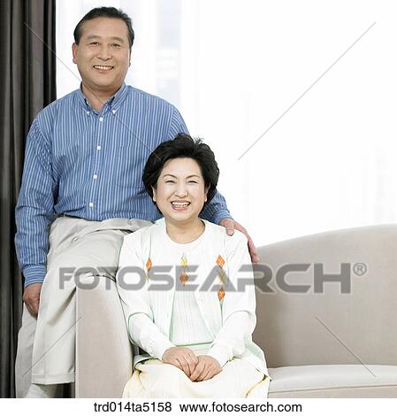 Stock Photo - an old couple on a sofa. Fotosearch