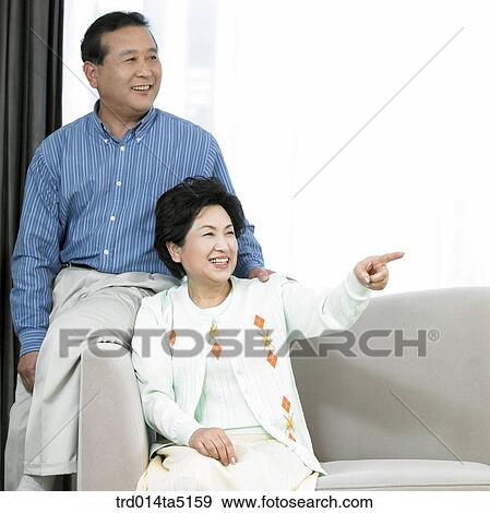 Stock Photo - an old couple on a sofa. Fotosearch