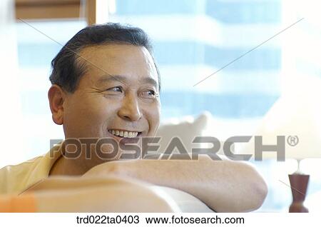 an old man on a sofa View Large Photo Image Stock Image - an old man on a sofa. Fotosearch