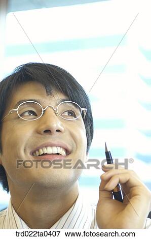 a businessman with a pen View Large Photo Image Stock Photo - a businessman with a pen. Fotosearch