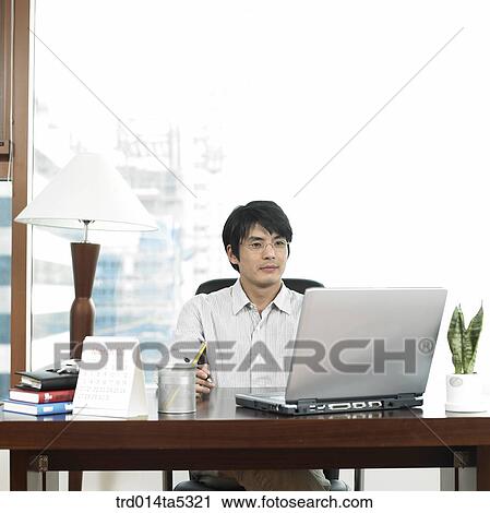 a businessman working with a notebook View Large Photo Image Stock Image - a businessman working with a notebook. Fotosearch