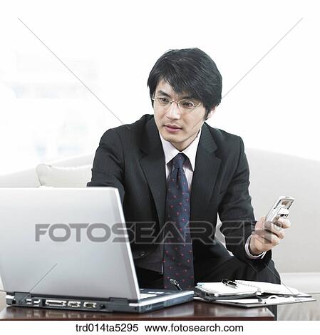a businessman working with a notebook View Large Photo Image Stock Photography - a businessman working with a notebook. Fotosearch