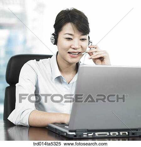 a businesswoman working with a PDA View Large Photo Image Stock Photography - a businesswoman working with a PDA. Fotosearch