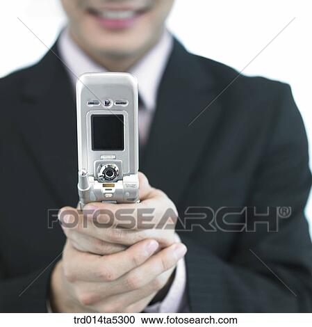 a hand with a mobile phone View Large Photo Image Stock Image - a hand with a mobile phone. Fotosearch