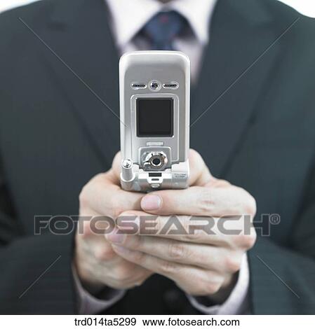 Stock Photo - a hand with a mobile phone. Fotosearch
