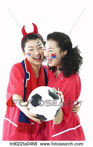 a ball and two supporters View Large Photo Image Stock Photo - a ball and two supporters. Fotosearch
