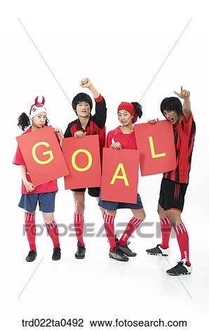 Stock Image - a cheering group of supporters holding a flag card. Fotosearch