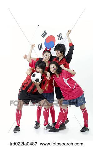 a cheering group of supporters holding Taegeukgi and a ball View Large Photo Image Stock Photo - a cheering group of supporters holding Taegeukgi and a ball. Fotosearch