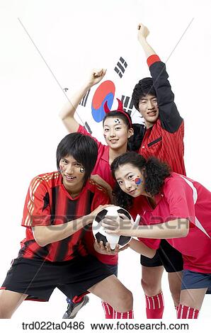 a cheering group of supporters holding Taegeukgi and a ball View Large Photo Image Stock Photograph - a cheering group of supporters holding Taegeukgi and a ball. Fotosearch