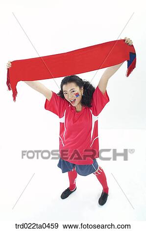 a cheering supporter holding a towel View Large Photo Image Stock Photo - a cheering supporter holding a towel. Fotosearch