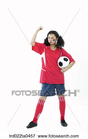 Stock Photo - a cheering supporter holding her hands high. Fotosearch
