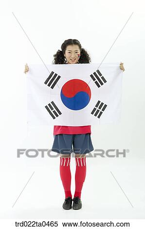 a cheering supporter holding Taegeukgi View Large Photo Image Stock Photography - a cheering supporter holding Taegeukgi. Fotosearch