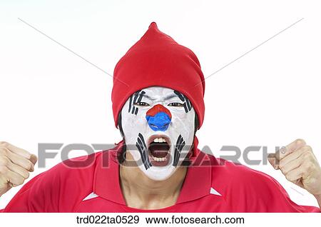 Stock Photo - a face-painting supporter. Fotosearch