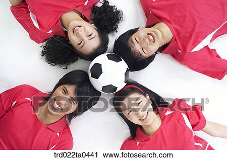 a group of supporters holding a ball by their heads View Large Photo Image Stock Image - a group of supporters holding a ball by their heads. Fotosearch
