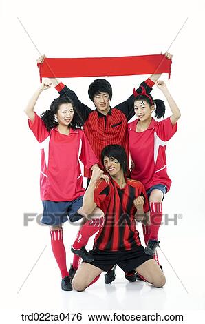 a group of supporters holding a towel View Large Photo Image Stock Photograph - a group of supporters holding a towel. Fotosearch