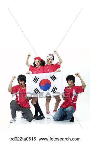 Stock Photography - a group of supporters holding Taegeukgi. Fotosearch