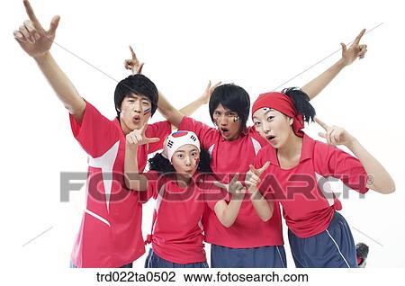 Stock Image - a group of supporters holding their hands high. Fotosearch