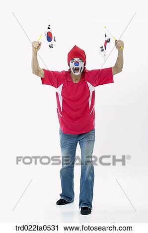 a shouting supporter holding Taegeukgi View Large Photo Image Stock Image - a shouting supporter holding Taegeukgi. Fotosearch