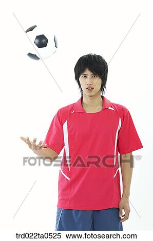a soccer player throwing a ball View Large Photo Image Stock Photography - a soccer player throwing a ball. Fotosearch
