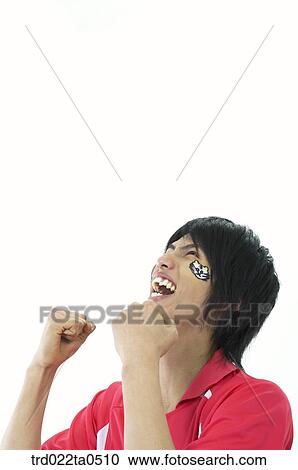 Stock Image - a supporter clenching their fists. Fotosearch