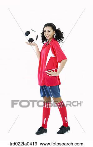 a supporter holding a ball View Large Photo Image Stock Photo - a supporter holding a ball. Fotosearch