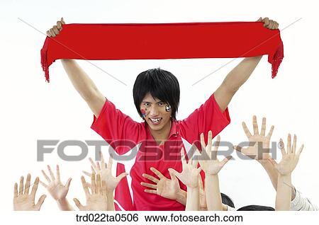 a supporter holding a towel and others' hands View Large Photo Image Stock Photograph - a supporter holding a towel and others' hands. Fotosearch